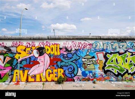 Graffiti on original section of Berlin Wall at East Side Gallery in ...