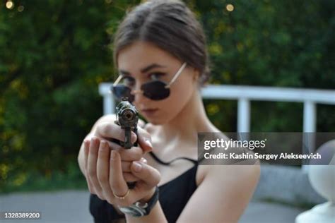 Woman Pointing Gun Photos and Premium High Res Pictures - Getty Images