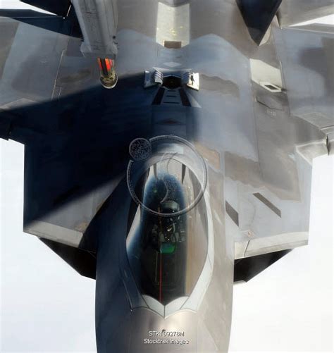 An F-22 Raptor maneuvers into refueling position. | Stocktrek Images