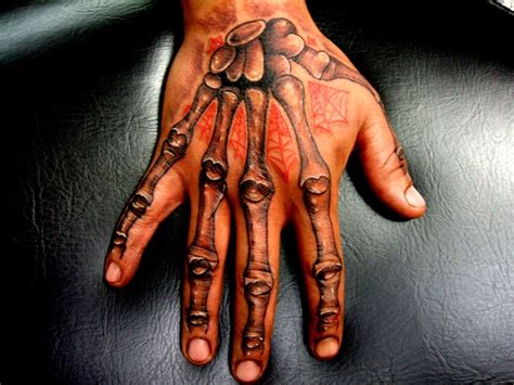 Skeleton Hand Tattoo Meaning | Tribal Tattoos X