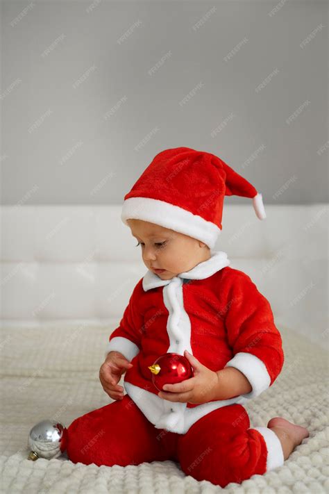 Premium Photo | Baby wearing santa outfit full shot