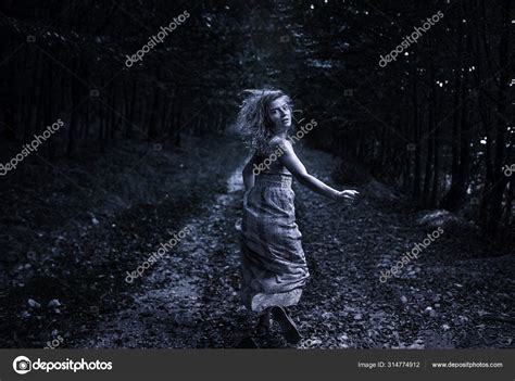 Scared Woman Running Forest Stock Photo by ©Xalanx 314774912