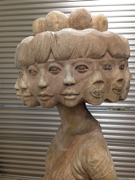 Japanese Artist Turns Wood Into Twelve-Faced Girl And Other Weird ...