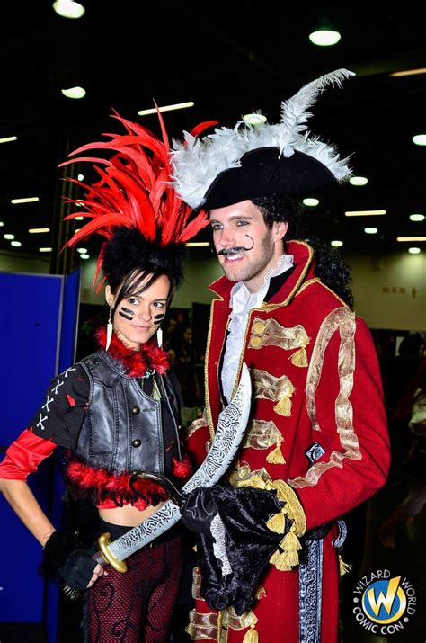 a man and woman dressed up in costumes