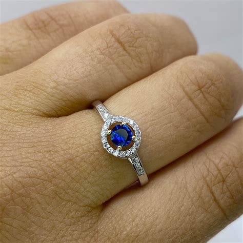 Sapphire Halo Ring - John Fitzgerald Jewellers - Watchmaker & Jewellers ...