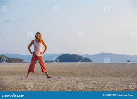 Man is Doing Yoga on the Beach Stock Image - Image of beach ...