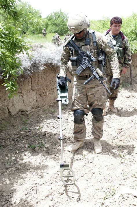 Counter-IED teams locate roadside bombs using 'metal detectors on ...