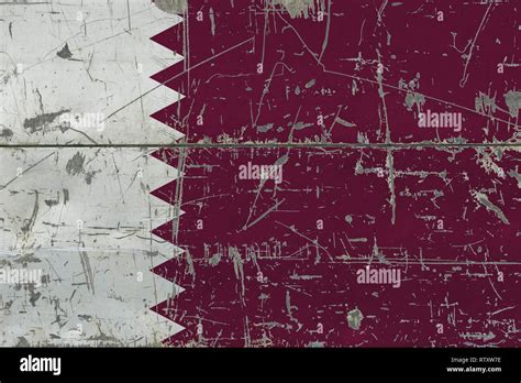 Grunge Qatar flag on old scratched wooden surface. National vintage ...