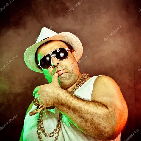 italian funny mafia boss rapper with undershirt and sunglasses on smoky ...