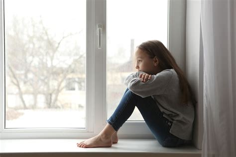 Premium Photo | Lonely sad girl at home saddened alarmed child alone at ...