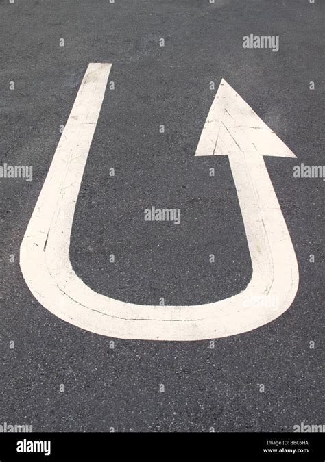 U turn sign on the road arrow Stock Photo - Alamy