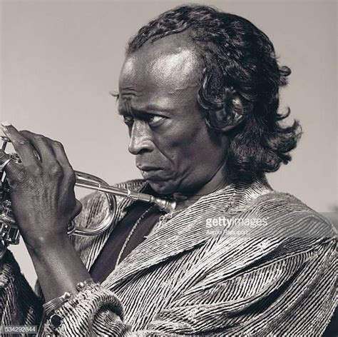 Miles Davis holding a trumpet | Miles davis, Jazz musicians, Portrait