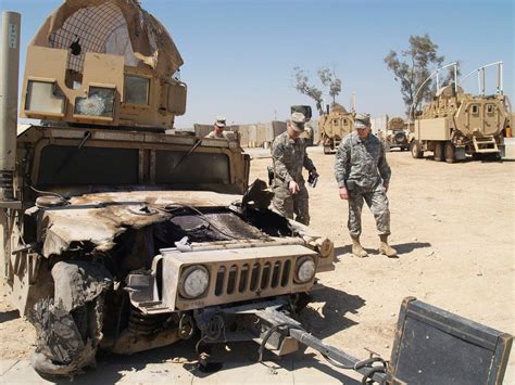 A U.S. Army HMMWV after an IED ambush during a patrol. Al Hillah, 100 ...