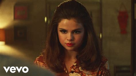 Selena Gomez is blonde and caught in a love triangle in 'Bad Liar' video