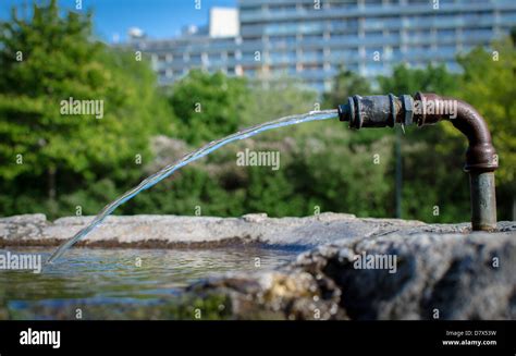 Drinking Fountain With Fresh Water In Front Of Modern Office Building ...