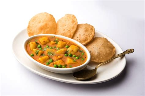 Aloo Sabzi with Gravy Accompanied by Fried Puri Stock Photo - Image of ...