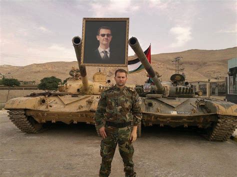 Two Syrian Arab Army T-72M1 tanks, with the portrait of president ...