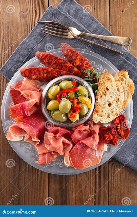 Platter of Serrano Jamon Cured Meat, Ciabatta, Chorizo and Olive Stock ...