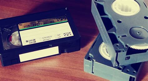 Betamax Tapes on Top of Brown Wooden Surface · Free Stock Photo