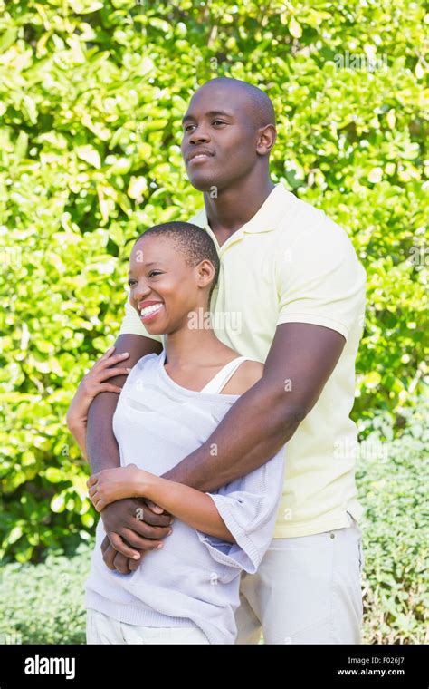 Happy smiling couple to hug Stock Photo - Alamy