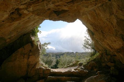 Cave exit stock photo. Image of round, clouds, entrance - 1319460