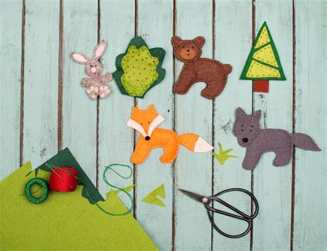 Premium Photo | Handmade felt toys animals over wooden rustic ...