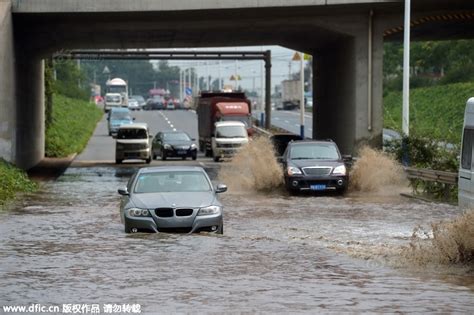 PHOTOS: Beijing hit with first flood of the summer – Thatsmags.com