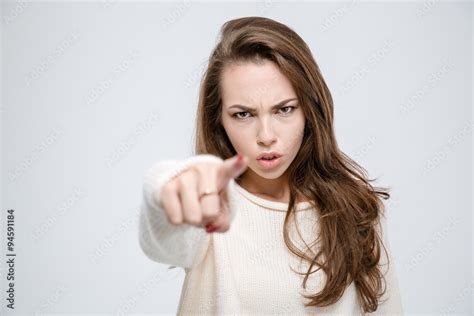 Angry woman pointing finger at camera Stock Photo | Adobe Stock