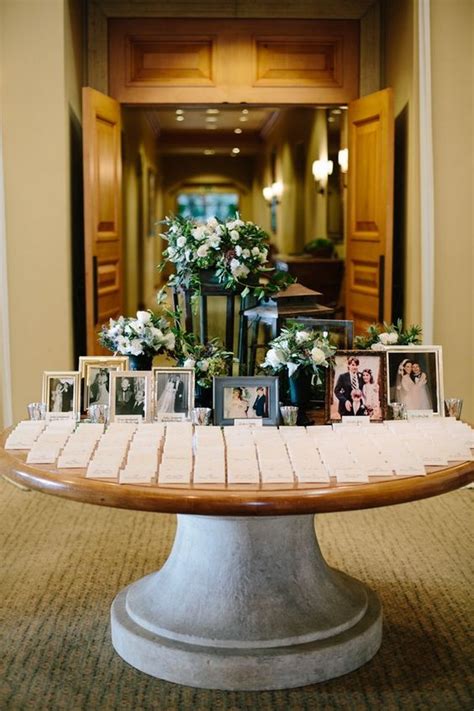 elegant wedding place card table with wedding photos - EmmaLovesWeddings