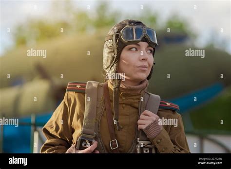 A young female pilot in uniform of Soviet Army pilots during the World ...