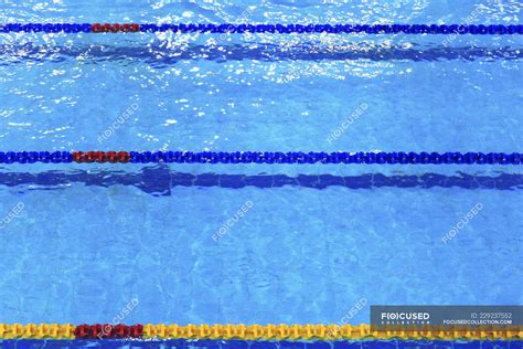 Swimming pool lane dividers, selective focus — no people, material ...