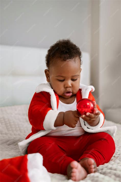 Free Photo | Full shot baby wearing santa outfit