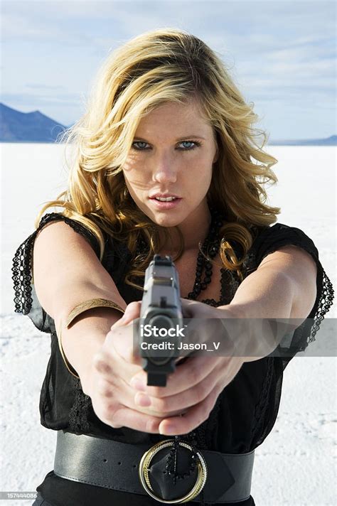 Woman Pointing Gun Stock Photo - Download Image Now - 20-29 Years ...