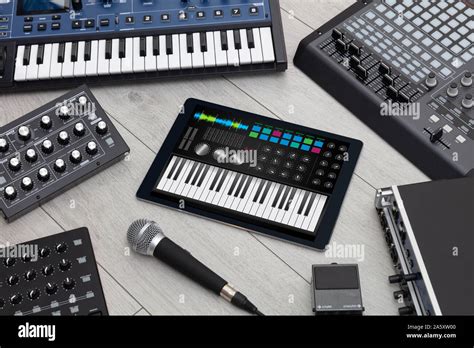 Piano synthesizer app on tablet and musical instrument concept Stock ...