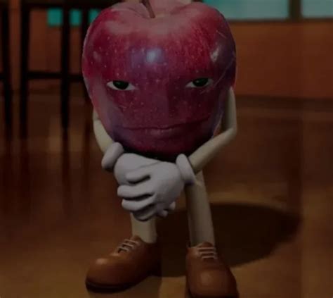 an apple sitting on top of a wooden floor