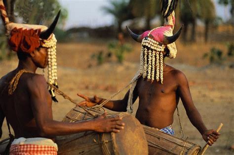 Two young men of the Koya tribe wearing headdresses of cattle horns and ...