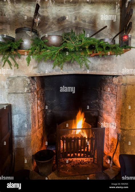 Medieval Christmas decorations over fireplace during Tudor event at ...