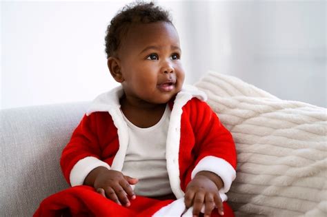 Free Photo | Baby wearing santa outfit medium shot