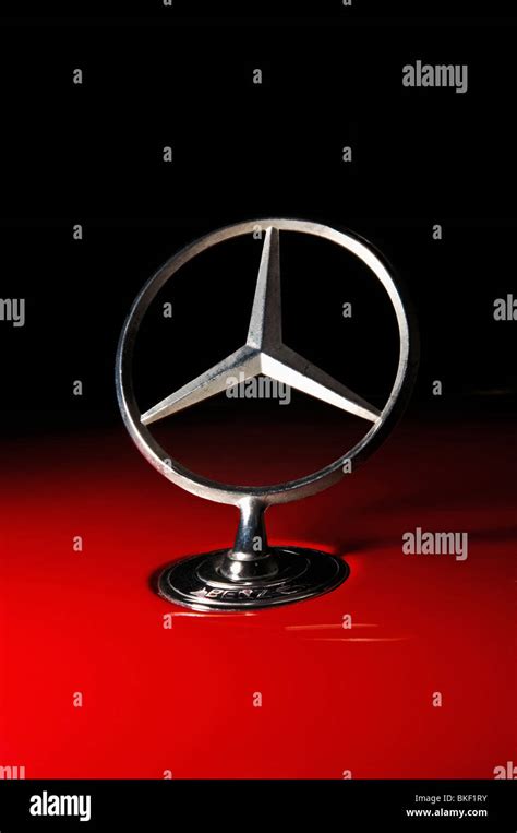 Mercedes Benz Hood Ornament, Emblem, star, on red Mercedes Stock Photo ...