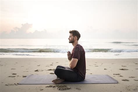 Man Practicing Yoga on the Beach Stock Photo - Image of outdoors ...