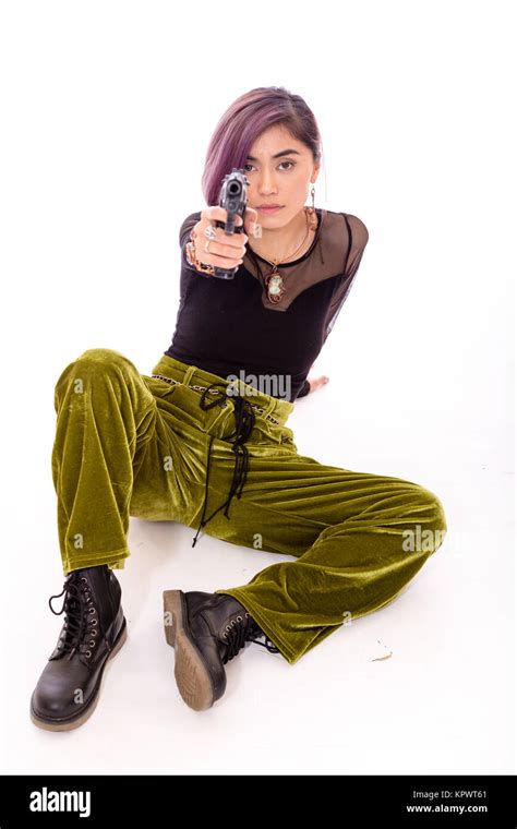 Young woman pointing a gun hi-res stock photography and images - Alamy