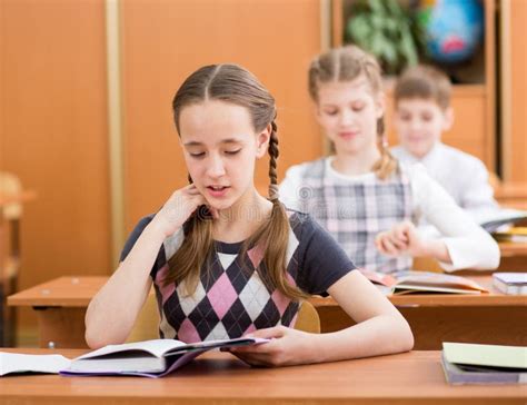 School Kids In Classroom At Lesson Stock Photo - Image of elementary ...