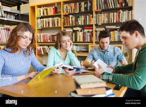 students reading books in library Stock Photo - Alamy