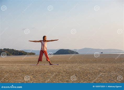 Man is Doing Yoga on the Beach Stock Image - Image of health, harmony ...