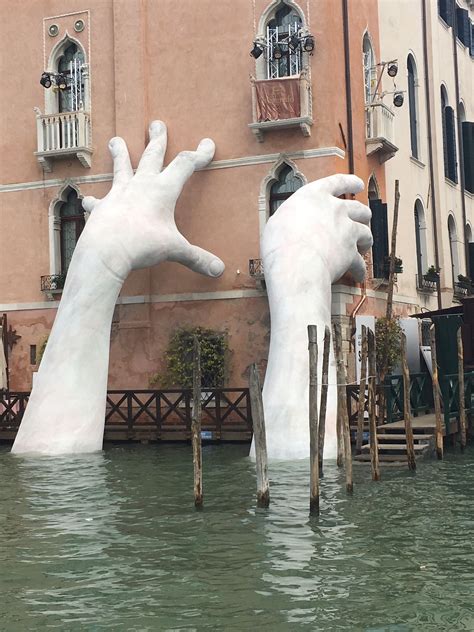 Giant Hands Emerge From a Venice Canal to Raise Climate Change ...