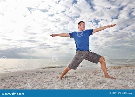 Man Exercising Yoga at the Beach. Stock Photo - Image of attractive ...