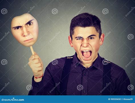 Angry Man Taking Off Mask with Grumpy Face Expression Stock Photo ...