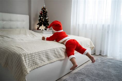 Free Photo | Full shot baby wearing santa outfit