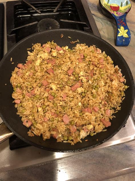 a frying pan filled with food on top of a stove