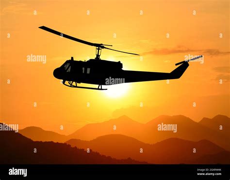 American utility military helicopter in the flight Stock Photo - Alamy